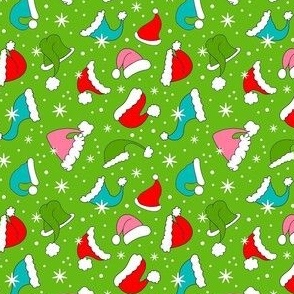 Small Scale Colorful Santa Hats and Snowflakes on Green
