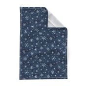 Shibori Snow and Stars on Dark Indigo (small scale) | Snowflakes and gold stars on arashi shibori linen pattern, block printed stars on navy blue, Christmas fabric, winter night sky.