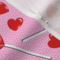 heart lollipops on pink with polka dots