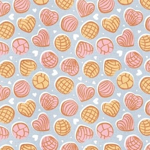 Tiny scale // Mexican pan dulce // pastel blue background pink and yellow conchas