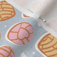 Small scale // Mexican pan dulce // pastel blue background pink and yellow conchas