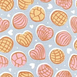 Small scale // Mexican pan dulce // pastel blue background pink and yellow conchas