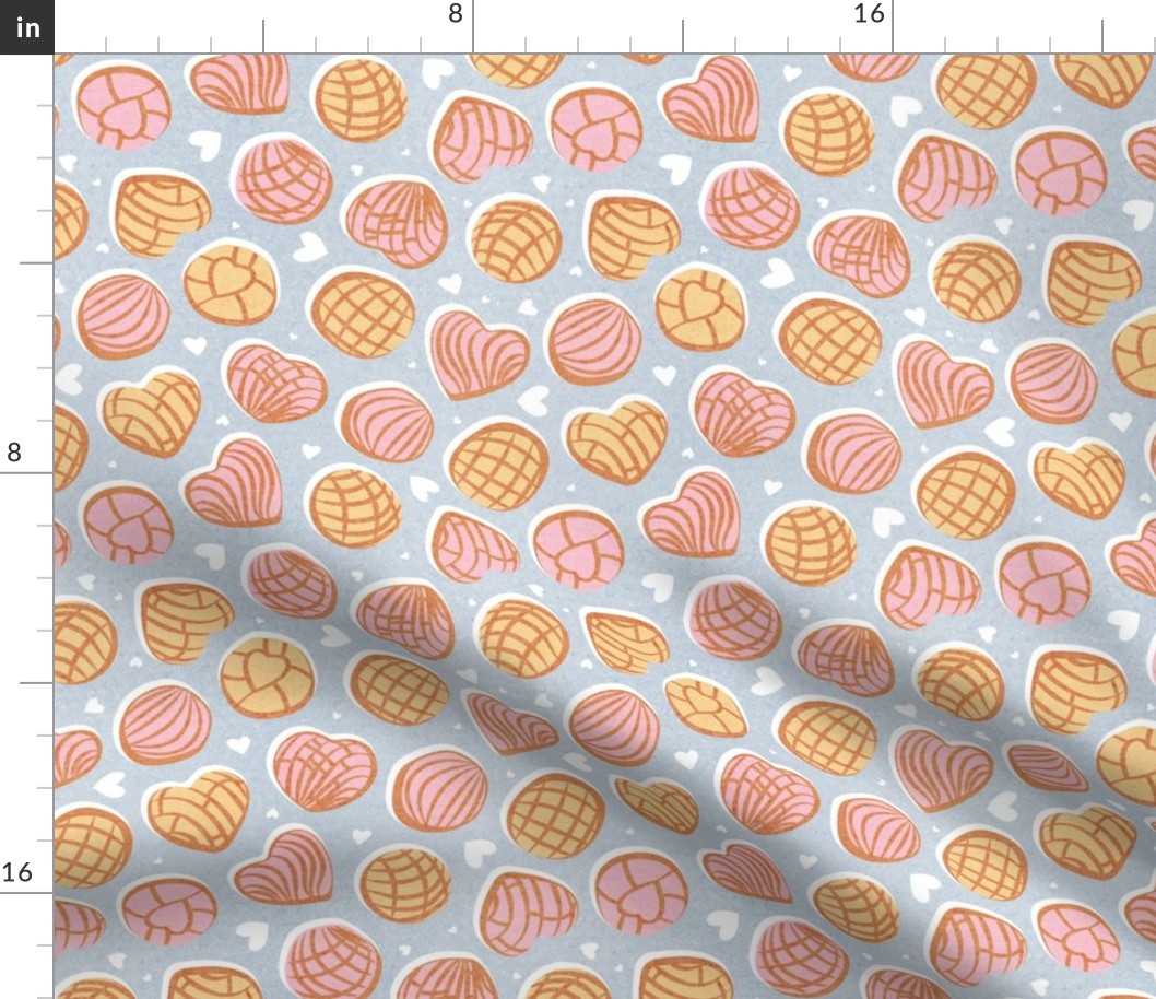 Small scale // Mexican pan dulce // pastel blue background pink and yellow conchas