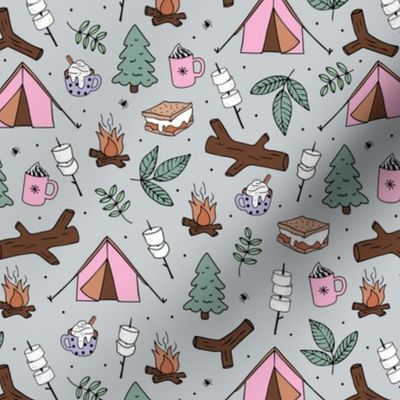 Winter wonderland camping trip outside adventures with campfire marshmallows and hot chocolate pine tree forest and wood logs pink burnt orange sage green lilac on soft gray
