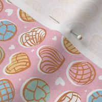 Tiny scale // Mexican pan dulce // pastel pink background multicolored conchas