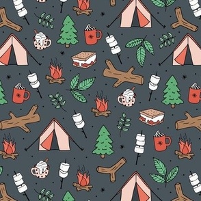 Winter wonderland camping trip outside adventures with campfire marshmallows and hot chocolate pine tree forest and wood logs green red christmas palette on charcoal gray