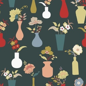 Flowers in vases on dark green