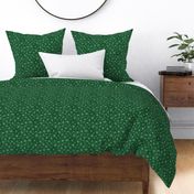 Shibori Snow and Stars on Deep Green (extra small scale) | Snowflakes and gold stars on arashi shibori linen pattern, block printed stars on pine forest green, Christmas fabric, winter night sky.