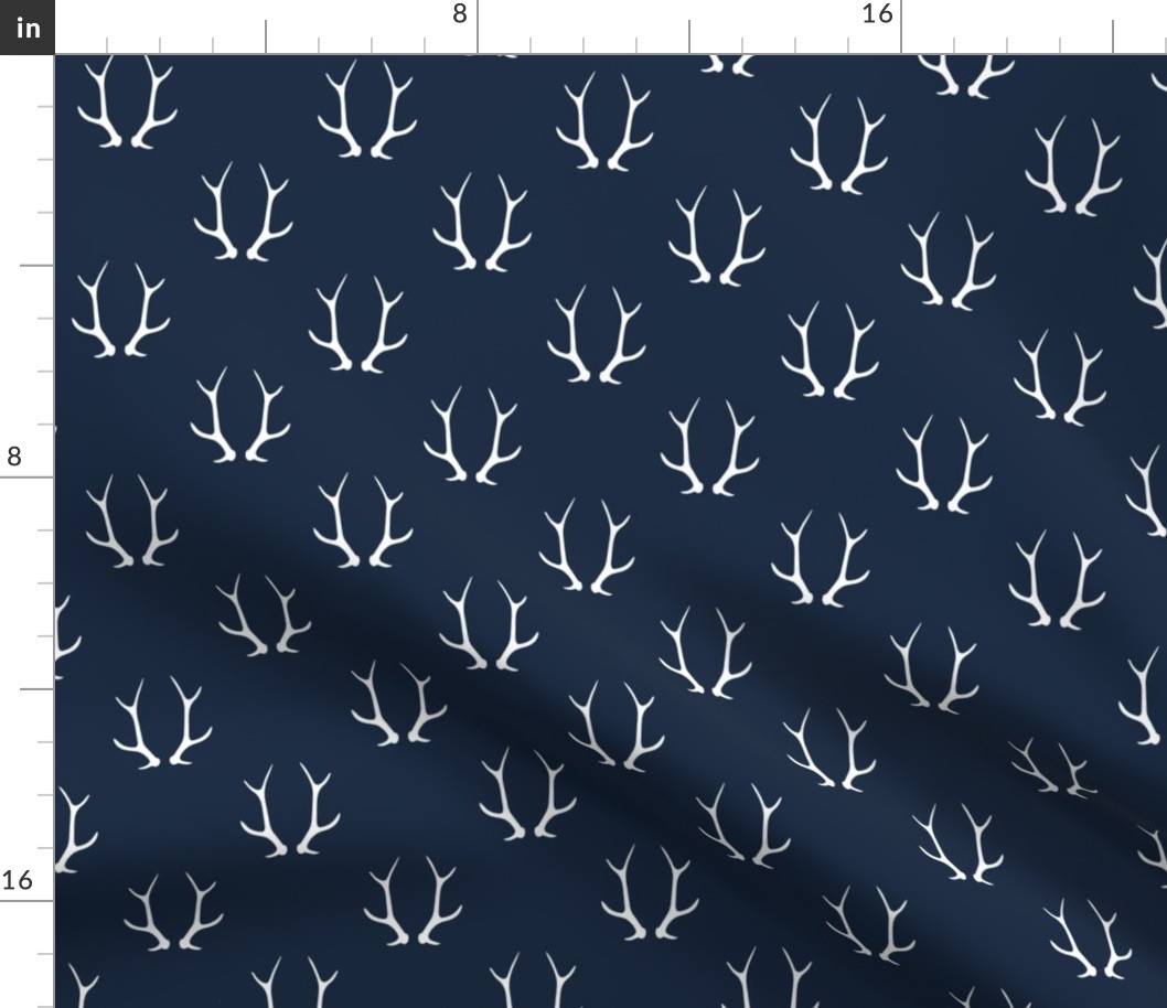 2" antlers on dark blue