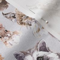 fluffy woodland animals on gray linen background