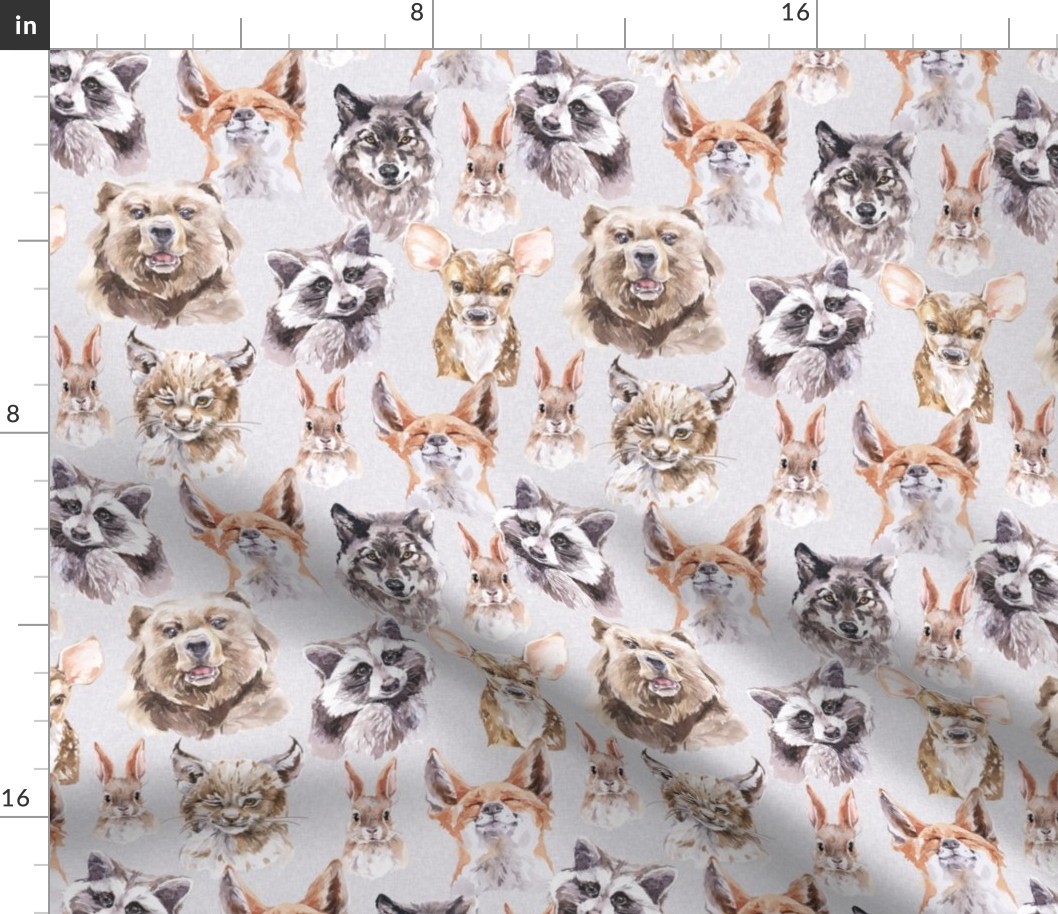 fluffy woodland animals on gray linen background