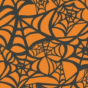 Black Spiderwebs on Orange