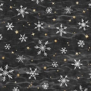 Shibori Snow and Stars in Charcoal (small scale) | Snowflakes and gold stars on arashi shibori linen pattern, block printed stars, black and gold, Christmas fabric, winter night sky.