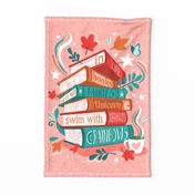 In life as in books dance with fairies, ride a unicorn, swim with mermaids, chase rainbows motivational quote tea towel or wall hanging // sundown pink background red orange and green books