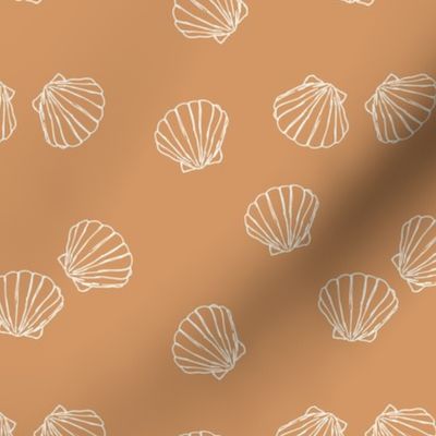 The messy sea side ocean shells beach theme boho style island vibes white on caramel vintage orange