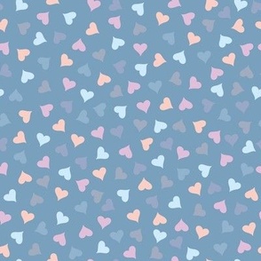 Pastel hearts and silhouettes abstract pattern on a blue background