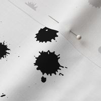 BLACK INK SPOTS ON A WHITE BACKGROUND