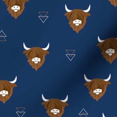 Sweet highlands with white horns and fuzzy hair highland cows rust brown on navy blue night