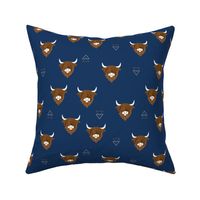 Sweet highlands with white horns and fuzzy hair highland cows rust brown on navy blue night