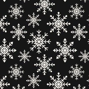 cream snowflakes on black