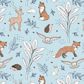 Woodland animals autumn garden deer foxes bunnies hedgehogs and owls sage orange beige brown on light blue 