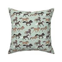 Wild West running rodeo horses meadow in chocolate brown beige cinnamon on sage green 