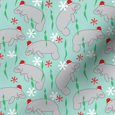 medium manatees with santa hats on teal