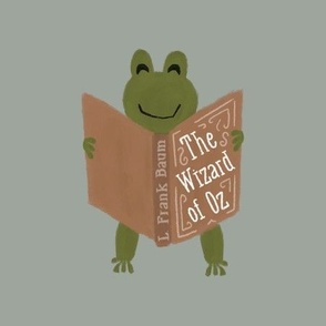 9" square: frog reading the wizard of oz