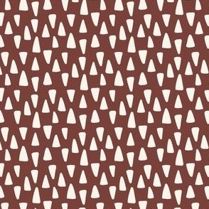 Small Geometric Triangle Shapes in Maroon Red