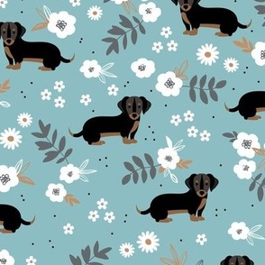 Adorable dachshund puppies with flowers and leaves boho garden style dog design for kids green white on blue 