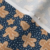 Little Christmas cookies and gingerbread men in ginger cinnamon on navy blue SMALL