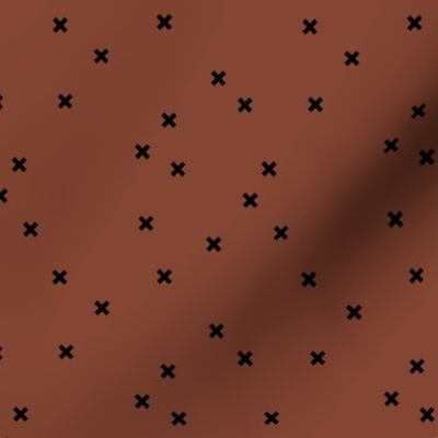 Geometric crosses Scandinavian abstract sign design little plus black on spice rust