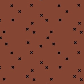 Geometric crosses Scandinavian abstract sign design little plus black on spice rust