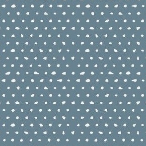 White hand drawn dots on blue background-small