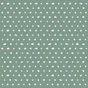 White hand drawn dots on green background-small