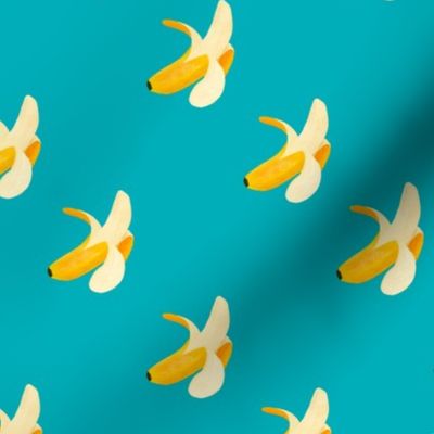 Yellow bananas open on blue background 