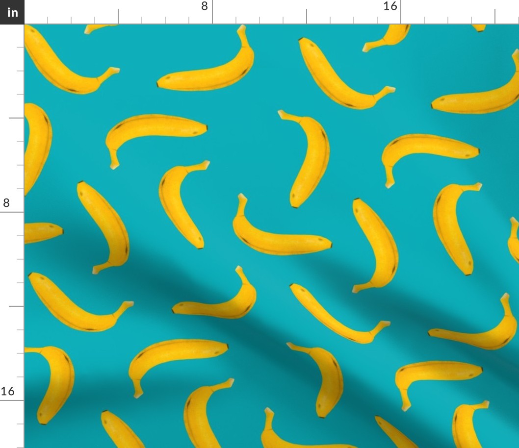Yellow bananas tossed on blue 