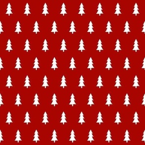 small white pine tree silhouettes on Christmas red