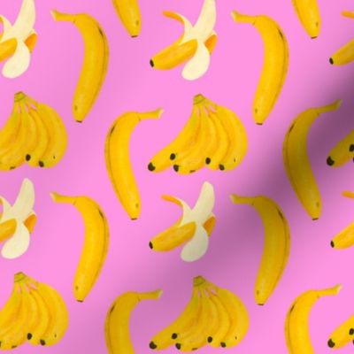 Yellow bananas assorted on pink background 