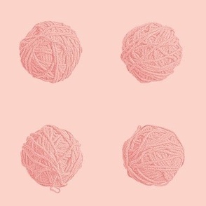 little yarn balls in coral pink