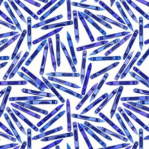 tiny blue crayons on white