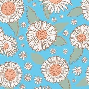 Sunflowers and daisies on blue