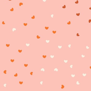 large // scattered hearts on light pink