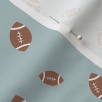American football minimalist sports design in brown leather on moody blue
