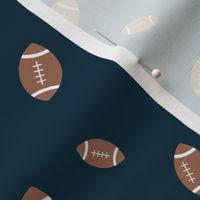 American football minimalist sports design in brown leather on navy blue night 