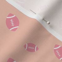 American football minimalist sports design in pink on peach blush