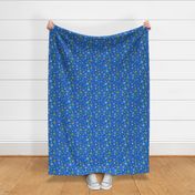 Colorful snowflakes on blue fabric design repeat pattern