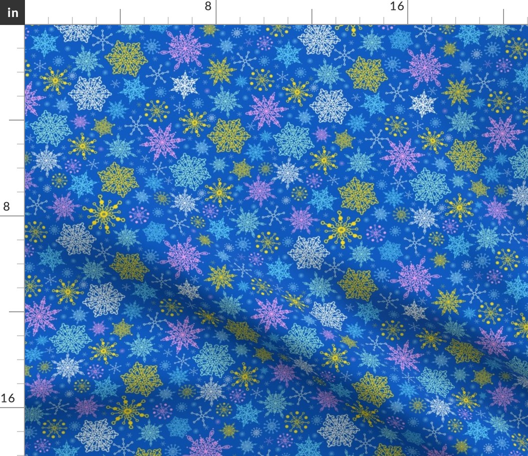 Colorful snowflakes on blue fabric design repeat pattern