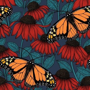 Monarch butterflies on red coneflowers  on navy