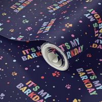 Colorful rainbow barkday design with confetti paws and happy birthday text for dogs on deep navy 